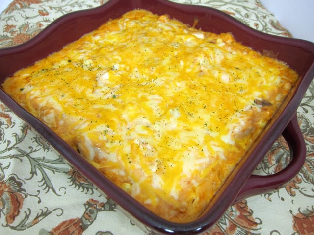 Doritos Cheesy Chicken Casserole - THE BEST Mexican casserole EVER! Chicken, sour cream cream of mushroom, cream of chicken, salsa, corn, cheese and Doritos! Everyone goes nuts over this casserole. Only takes a minute to assemble and it is ready to eat in 20 minutes. SO quick and easy. Great for a crowd - even picky eaters love this!