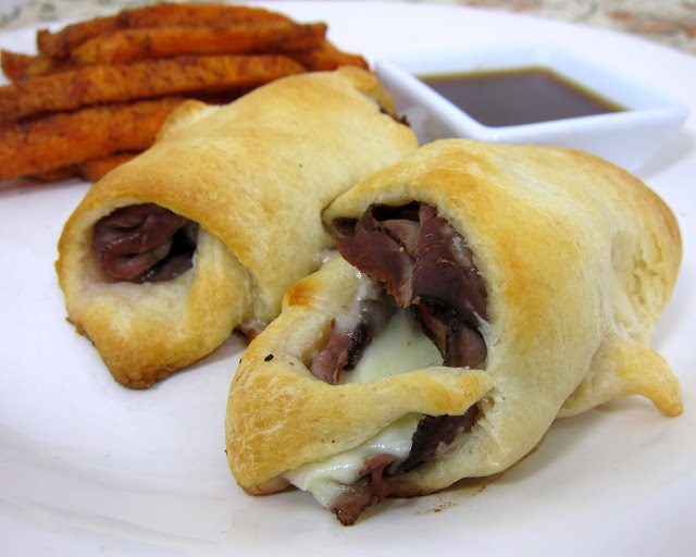 French Dip Crescents - only 5 ingredients. Ready in under 20 minutes!! Roast beef, provolone, horseradish wrapped in crescent rolls - serve with a side of au jus gravy