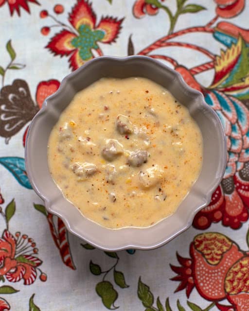 Sausage and Grits Chowder - sausage, potato soup, creamed corn, milk, cajun seasoning, grits and water. Ready in about 15 minutes! SO delicious! 