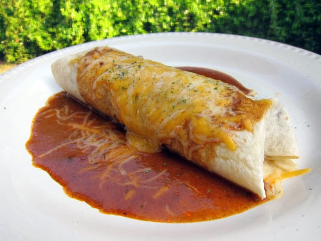 Slow Cooker Chile Colorado Burritos - stew meat slow cooked in a homemade enchilada sauce - wrap meat in tortillas and top with cheese to serve. OMG! AMAZING! We always double the recipe for leftovers.