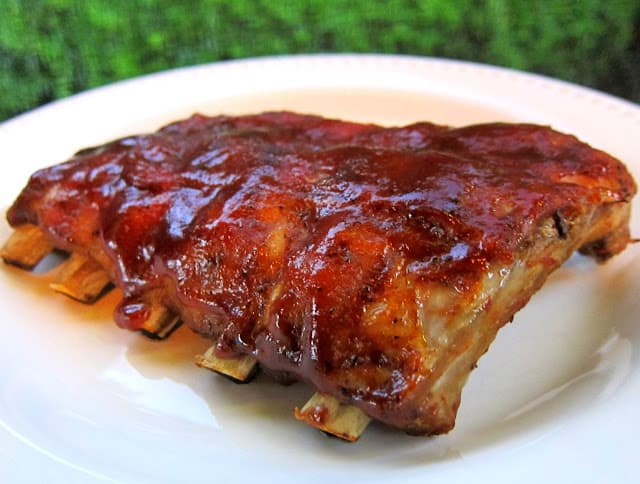 Slow Cooker Baby Back Ribs - THE BEST ribs! SO easy! Coat baby back ribs in a homemade BBQ rub and slow cook in the crockpot. Finish with some BBQ sauce. These are better than any restaurant!
