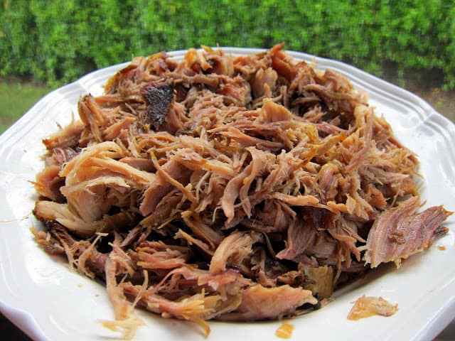 Slow Cooker Kalua Pork - only 3 ingredients! This is THE BEST pork EVER! So easy and it tastes amazing! Serve on rolls with slaw, on a salad or nachos. We can't get enough of this yummy pork!