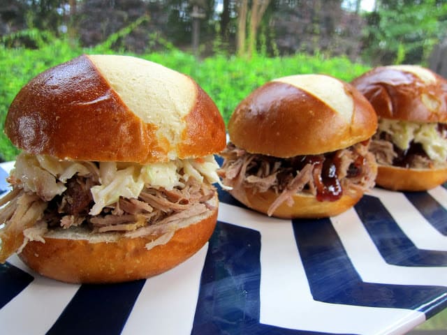 Slow Cooker Kalua Pork - only 3 ingredients! This is THE BEST pork EVER! So easy and it tastes amazing! Serve on rolls with slaw, on a salad or nachos. We can't get enough of this yummy pork!