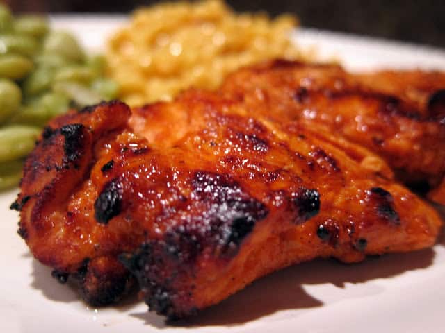 Grilled Buffalo Chicken - chicken marinated in butter, hot sauce, Worcestershire sauce, and onion powder. Seriously delicious!! Drizzle with a little ranch and you have a light and healthy meal!! #grilling #chicken