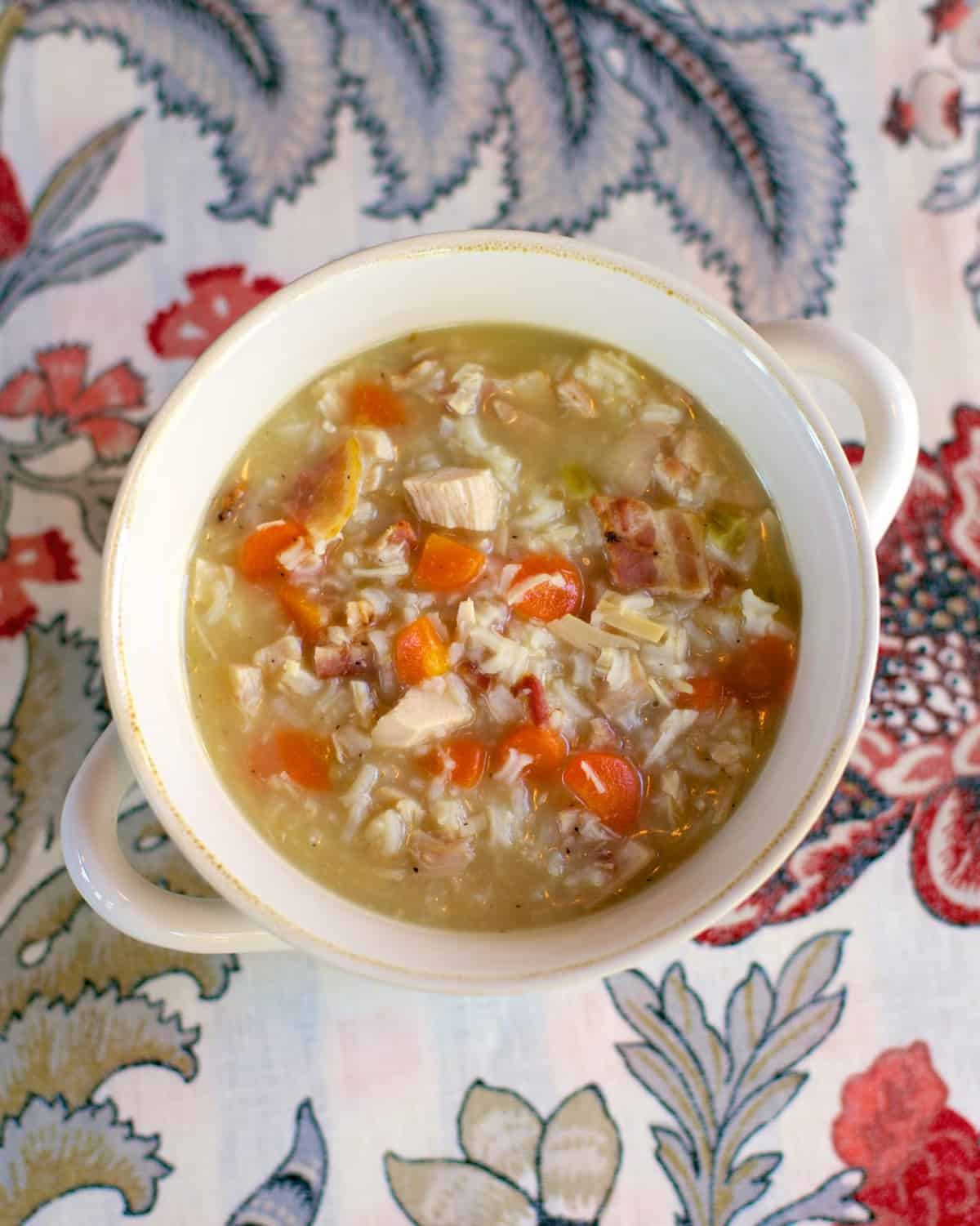 Chicken, Bacon & Rice Soup recipe - chicken broth, water, rice, cream of celery soup, carrots, bacon and chicken - use a rotisserie chicken and this soup is ready in 20 minutes! Just dump everything in the pot, bring to a boil and simmer. So easy and super delicious! Can also use uncooked chicken breast and make in the slow cooker.