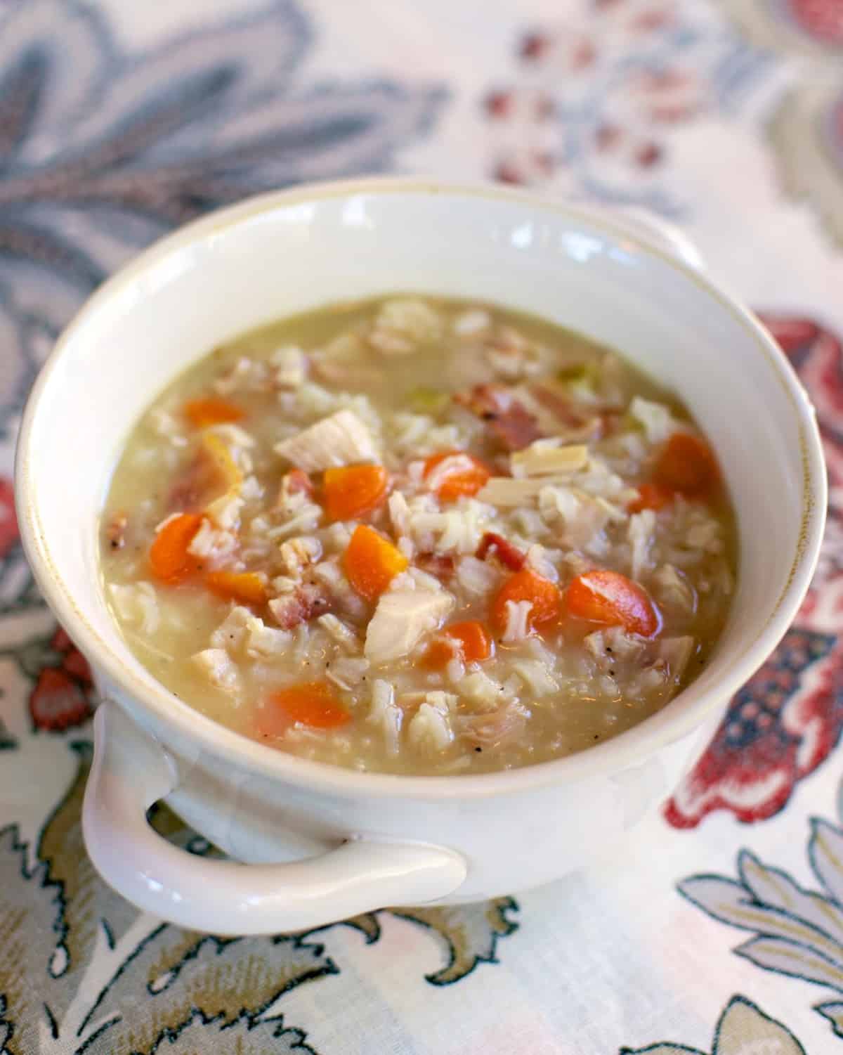 Chicken, Bacon & Rice Soup recipe - chicken broth, water, rice, cream of celery soup, carrots, bacon and chicken - use a rotisserie chicken and this soup is ready in 20 minutes! Just dump everything in the pot, bring to a boil and simmer. So easy and super delicious! Can also use uncooked chicken breast and make in the slow cooker.