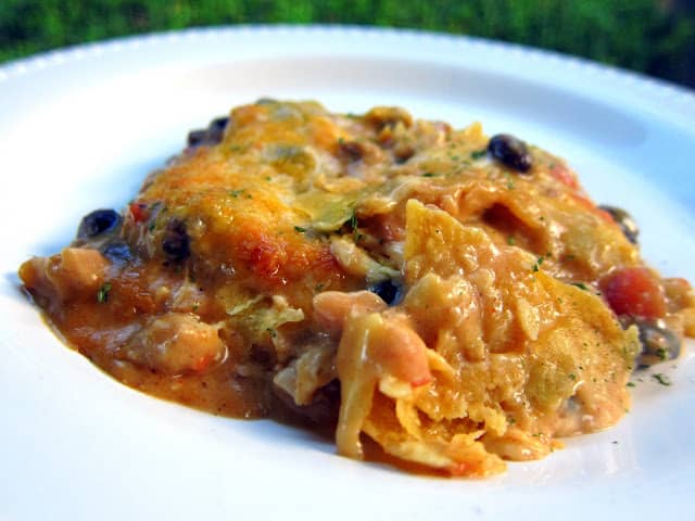 Chicken Taco Casserole - SO GOOD! Corn tortillas, cream of chicken soup, sour cream, Rotel, black beans, taco seasoning, chicken and cheese. Takes a minute to assemble and it on the table in 30 minutes. Everyone cleaned their plate and went for seconds. Great casserole for a potluck. Can also freeze for later. Quick, easy, kid friendly and delicious!