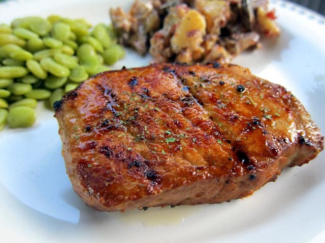 Grilled Lemon Pepper Pork Chops Recipe - boneless pork chops marinated in lemon pepper, soy sauce, Worcestershire Sauce and garlic - cook on the grill for a quick and delicious dinner! Can marinate the night before and grill when you get home from work.