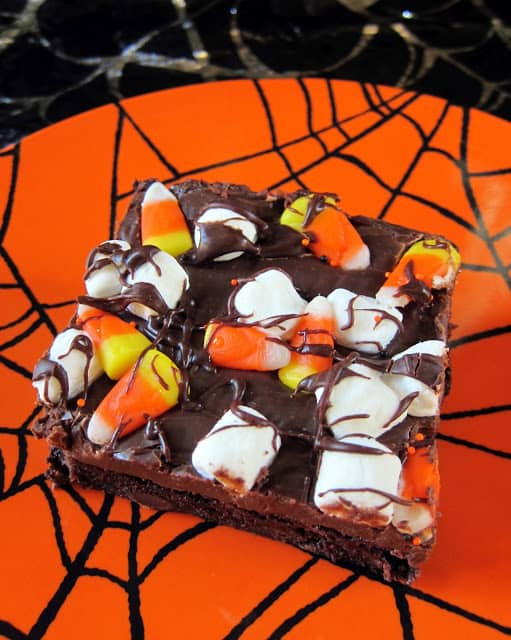 Haunted Road Brownies - brownies topped with a rich fudge frosting. Top with candy corn and marshmallows for a festive Halloween treat!