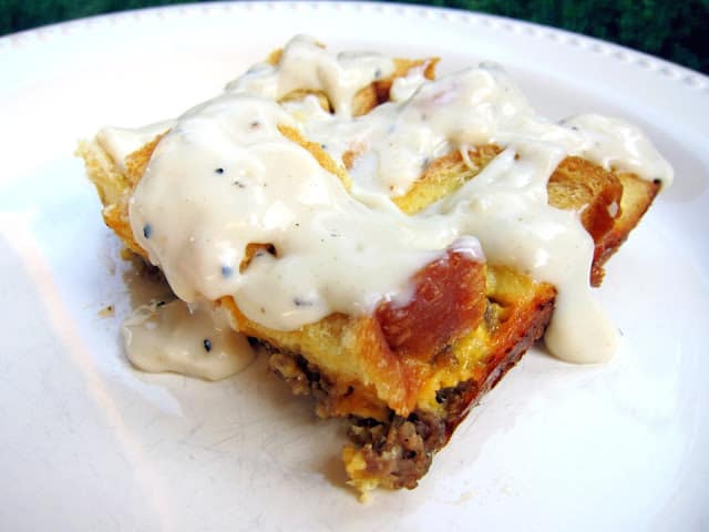 Sausage Gravy Breakfast Bake - sausage, cheese, eggs, bread and gravy - quick breakfast bake with crispy bread on top and drizzled with sausage gravy - SOOO good! We like to eat this for breakfast and dinner.