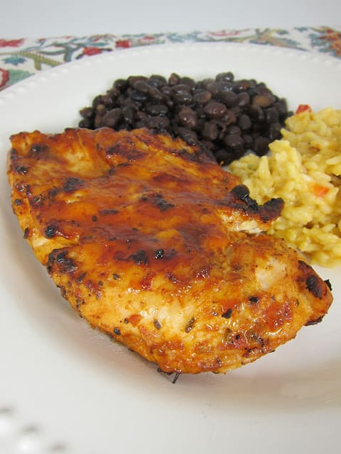 Taco Chicken Recipe - chicken breasts marinated in taco seasoning, oregano, olive oil, salsa, and cumin - grill or pan sear and brush with a mixture of BBQ sauce and chili sauce - AMAZING! I wanted to lick my plate! Great in tacos and salads.