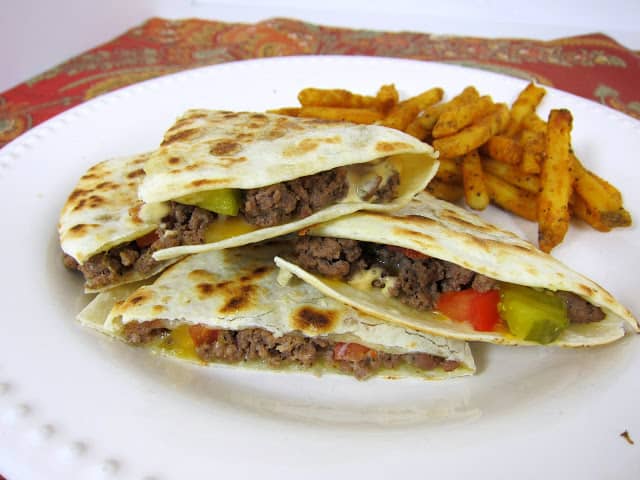 Bacon Cheeseburger Quesadillas - all the flavors of a bacon cheeseburger in a quesadilla! Can use ground turkey, turkey bacon and wheat tortillas for a healthy weekday meal.