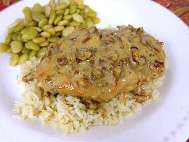 Toasted Pecan Chicken Recipe - pan seared chicken simmered in a creamy orange dijon sauce and toasted pecans. AMAZING flavor! Only takes 20 minutes from start to finish - no prep work. I am going to double the sauce next time so I can pour it over the rice. YUM!