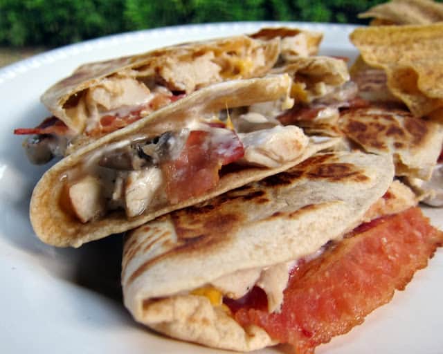 Chicken Bacon Ranch Quesadilla Recipe - so simple and SOOO addictive. Great recipe for a quick dinner or lunch. I always have the ingredients in the fridge so we can make these. We can't get enough of them! 