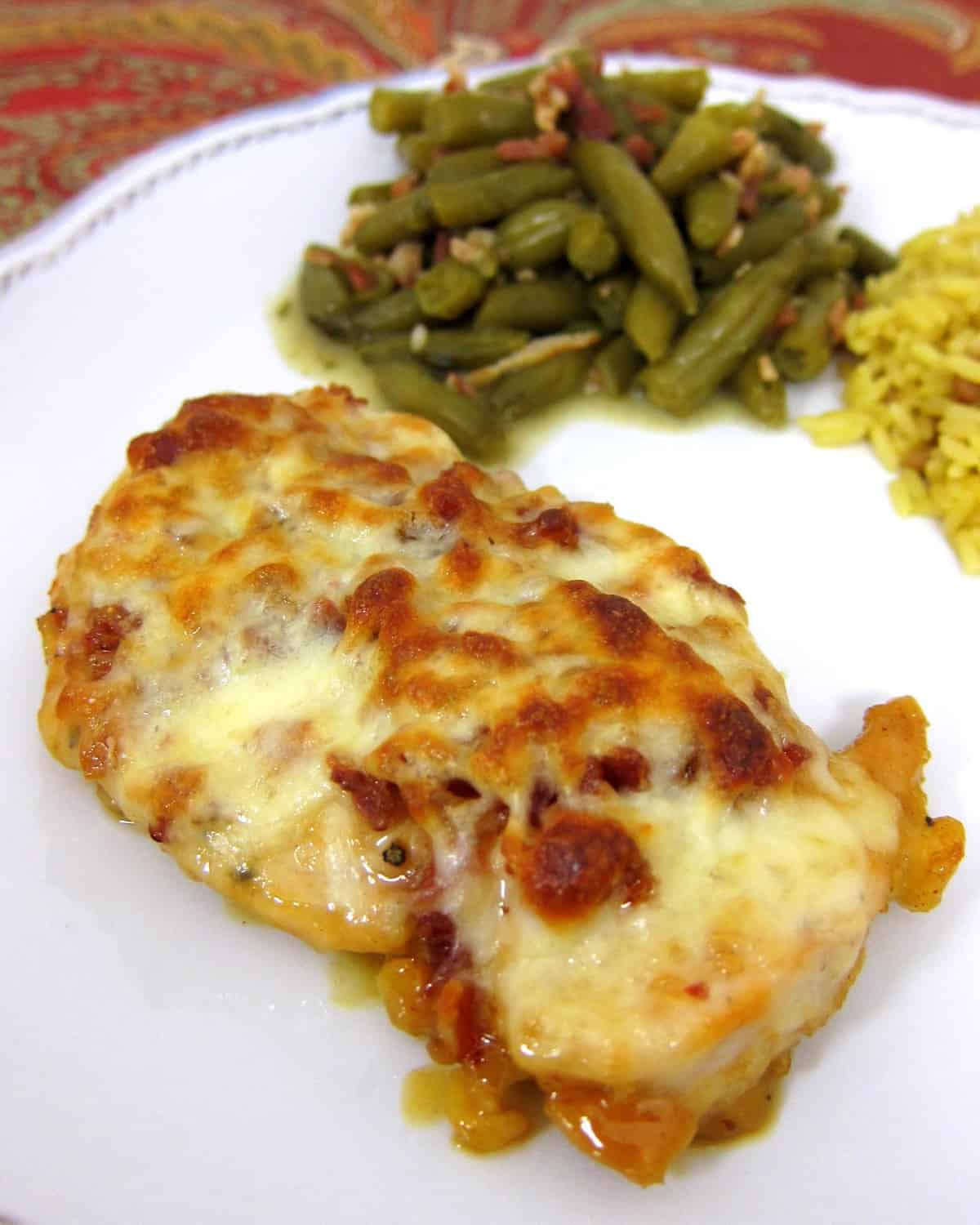 Cheesy Honey Mustard Chicken - TO DIE FOR!!! Chicken topped with honey, mustard, lemon juice, paprika, lemon pepper, bacon, Mozzarella and baked. Ready in under 30 minutes. We ate this two nights in a row. It is that good. Even picky eaters love this!