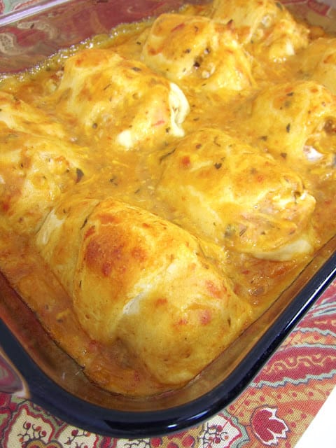 Southwestern Chicken Roll Ups - crescent rolls stuffed with chicken, cream cheese and taco seasoning topped with a mixture of chicken soup, salsa and cheese. CRAZY good! We make these once a month. Everyone loves this easy Mexican casserole! Ready in 30 minutes!