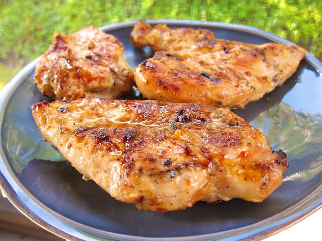 Sweet and Tangy Grilled Chicken Recipe - chicken marinated in cider vinegar, dijon mustard, garlic, lemon, lime and brown sugar. THE BEST! We make this at least twice a month. Great leftover on a salad or in a quesadilla.