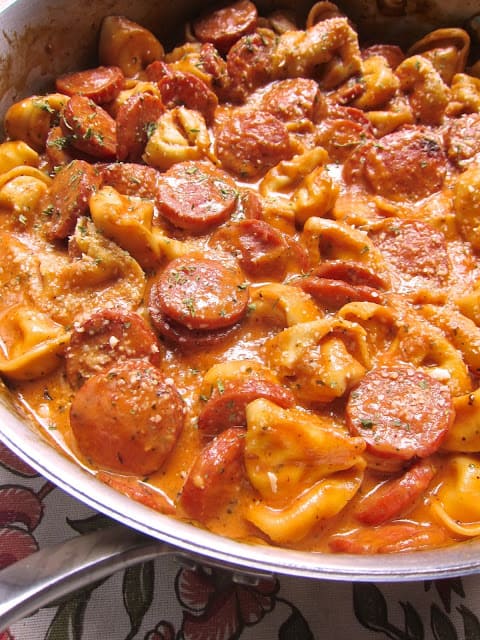 Cheesy Smoked Sausage Skillet - smoked sausage, tomato sauce, chicken broth, heavy cream, refrigerated cheese tortellini and parmesan. Everything cooks in the same pan! Even the pasta!! SO easy and super delicious! We ate this 2 nights in a row.
