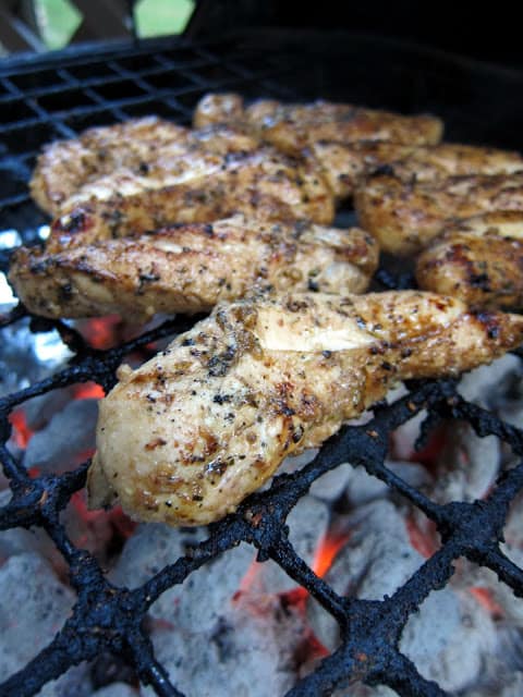 Grilled Italian Chicken Tenders Recipe - THE BEST grilled chicken! The chicken is marinated in olive oil, balsamic, garlic, onion, pepper and Italian seasonings. Grill or pan sear for the best chicken ever! We like to serve these over fettuccine alfredo or marinara and pasta.