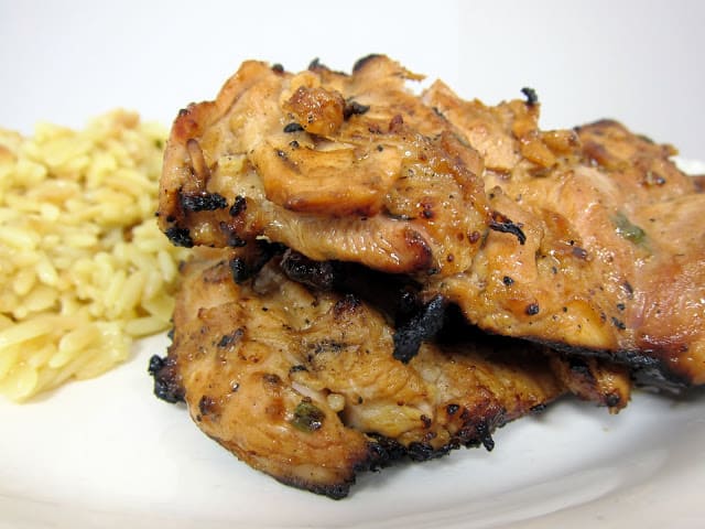 Grilled Dijon Chicken Thighs - boneless chicken thighs marinated in dijon, garlic, balsamic vinegar and rosemary. This chicken has SO much flavor! We always double the recipe so we have leftovers.