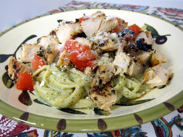 Creamy Lemon-Pesto Chicken Pasta Recipe - lemon pepper grilled chicken served over ligunie tossed in a quick creamy lemon/pesto sauce. Make the sauce while the chicken cooks - ready in under 30 minutes! We make this all the time during the summer.