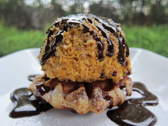 Faux Fried Ice Cream and Cinnamon Waffle Sundaes Recipe - ice cream coated in cinnamon, sugar and cornflakes placed on top of a cinnamon roll waffle! Sweet ending to your Mexican fiesta!