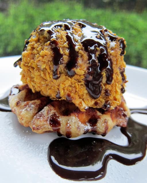 Faux Fried Ice Cream and Cinnamon Waffle Sundaes Recipe - ice cream coated in cinnamon, sugar and cornflakes placed on top of a cinnamon roll waffle! Sweet ending to your Mexican fiesta!