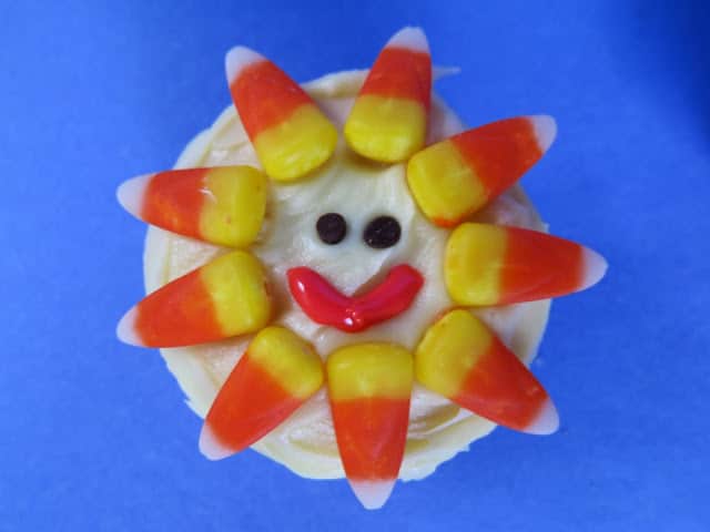 Lemon Sunshine Cupcakes - recipe for the best lemon cupcakes! Decorate with candy corn and icing for a fun summer treat!