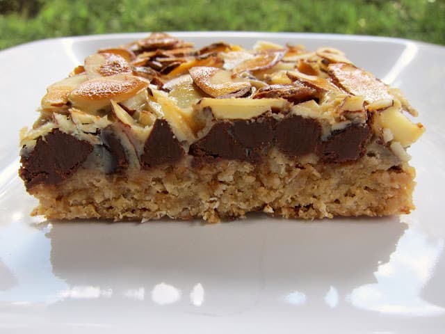 Almond Toffee Bars - graham cracker crust topped with almond bits, chocolate chips, sliced almonds and sweetened condensed milk - HIGHLY addictive. We could not stop eating these! Everyone always asks for the recipe when I bring them to parties.