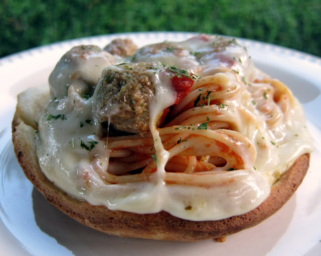 Spaghetti and Meatball Pot Pie Recipe - baked spaghetti and meatballs with a pizza dough crust - flip over for a fun way to eat pasta! Kids love this!!! Great way to use up leftover spaghetti and meatballs.