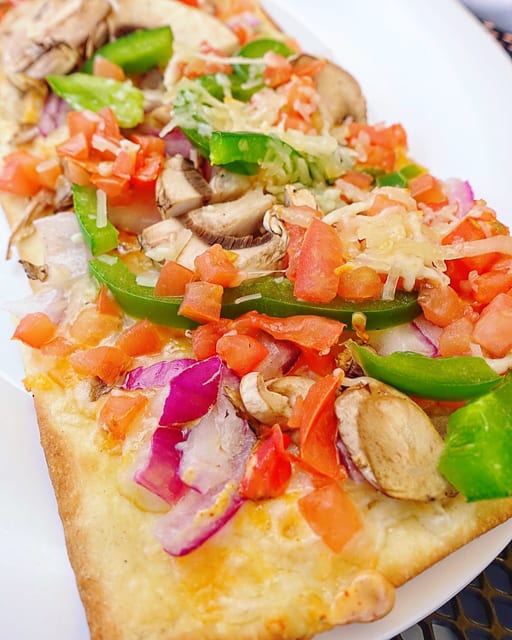The Veggie Flatbread at Beef O'Brady's in Birmingham, AL is great for an appetizer or main dish. Classic veggie with mushrooms, diced tomatoes, green peppers, red onions and topped with cheddar jack and Parmesan cheese.