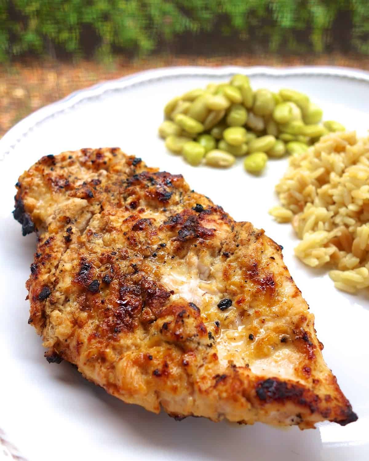 Lemon Garlic Marinade - our favorite! SO simple and SOOO delicious! Chicken marinated in olive oil, dijon mustard, garlic, salt, pepper and lemons. Everyone raves about this chicken!! TONS of flavor!