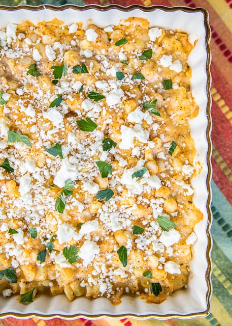 Mexican Street Corn Casserole - all the flavors of Mexican street corn but requires no flossing after eating! Corn, mayonnaise, sour cream, lime, parmesan, pepper jack, chili powder and feta. Can make ahead of time and refrigerate until ready to make. Great for potlucks, cookouts and the holidays! You might want to double the recipe - this doesn't last long!