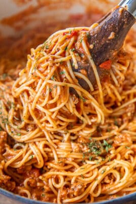 serving spaghetti from saucepan