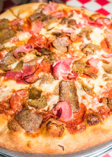 Meat Supreme Pizza at Carmelo's -  Where to Eat in St. Augustine, Florida - we found several hidden gems in St. Augustine that you MUST try on your next trip. Pizza, Burgers, Sandwiches, Craft Cocktails, and CRAZY milkshakes! Something for everyone!!