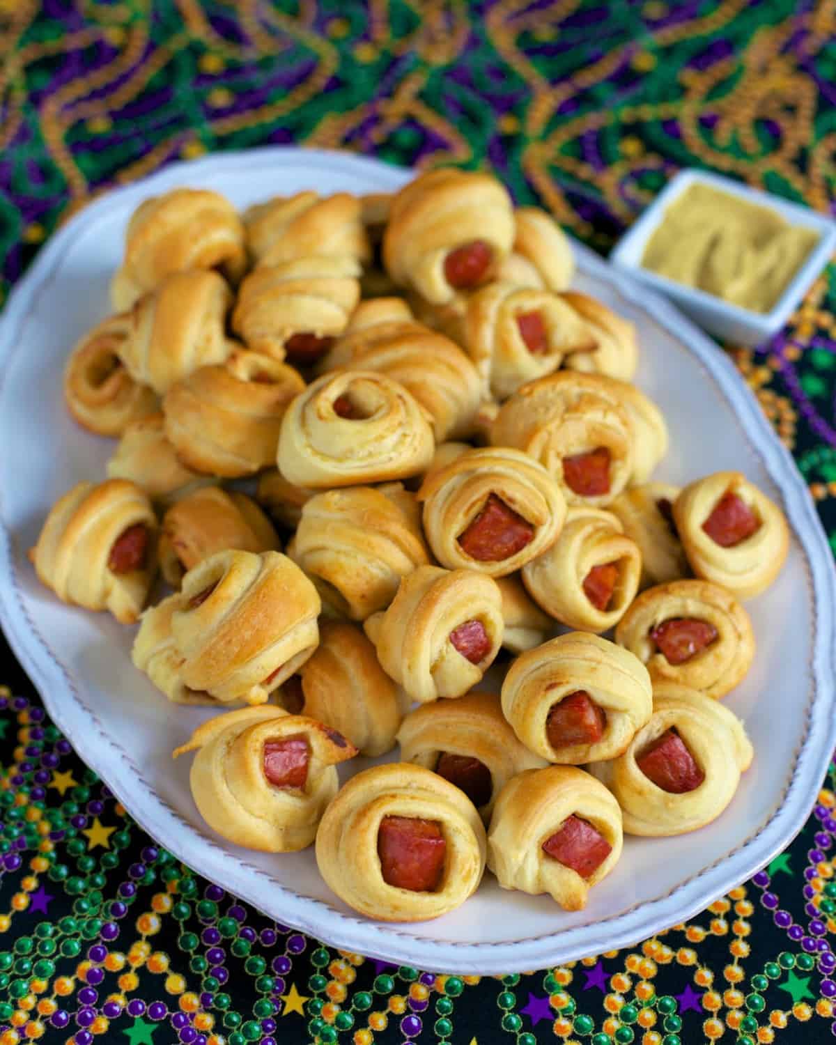 Andouille Pig in a Blanket - kick up ordinary pigs in a blanket with andouille sausage. Only 3 ingredients - andouille, mustard and crescent rolls.
