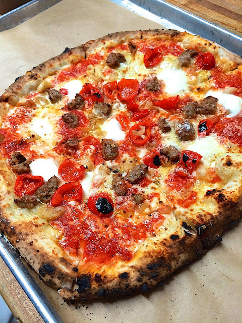 San Genarro Pizza from Antico in Atlanta, GA - topped with salsiccia, sweet red pepper, bufala and cipolline