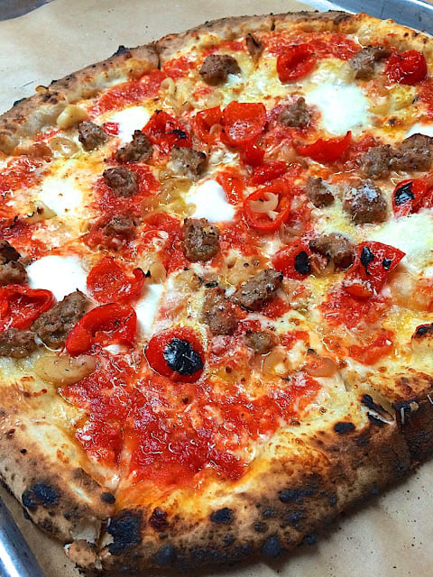 San Genarro Pizza from Antico in Atlanta, GA - topped with salsiccia, sweet red pepper, bufala and cipolline