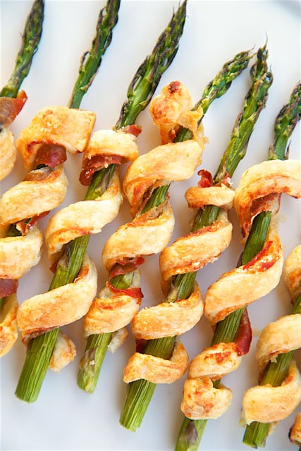 Prosciutto Wrapped Asparagus Puffs - only 5 ingredients! Asparagus, prosciutto, dijon mustard, parmesan cheese and puff pastry. Great side dish or appetizer. Can make ahead of time and freezer for later. You can't go wrong with this recipe! SO easy and delicious!!