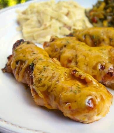Bacon Wrapped BBQ Chicken Tenders - chicken tenders wrapped with bacon and topped with BBQ sauce and cheese. Cook them in the skillet for about 10 minutes. The family went crazy over these! SO good and super quick and easy! Great weeknight meal!