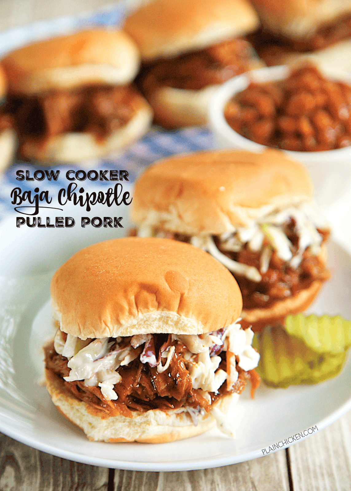 Slow Cooker Baja Chipotle Pulled Pork - only 4 ingredients! A little sweet and a little spicy. Cooks all day in the crock-pot. SO easy and it tastes AMAZING! Great for a crowd and tailgating! Serve as a sandwich, on a baked potato, over a salad or on top of nachos!