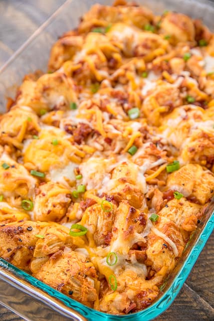 BBQ Chicken Bubble Up Pizza Recipe - Biscuit Pizza Casserole Recipe - Bubble Up Pizza - only 5 ingredients and ready in under 30 minutes! Refrigerated biscuits tossed in BBQ sauce chicken, bacon,topped with mozzarella and cheddar. We LOVE this casserole! We make this at least twice a month!! #pizza #casserole #chickenrecipe