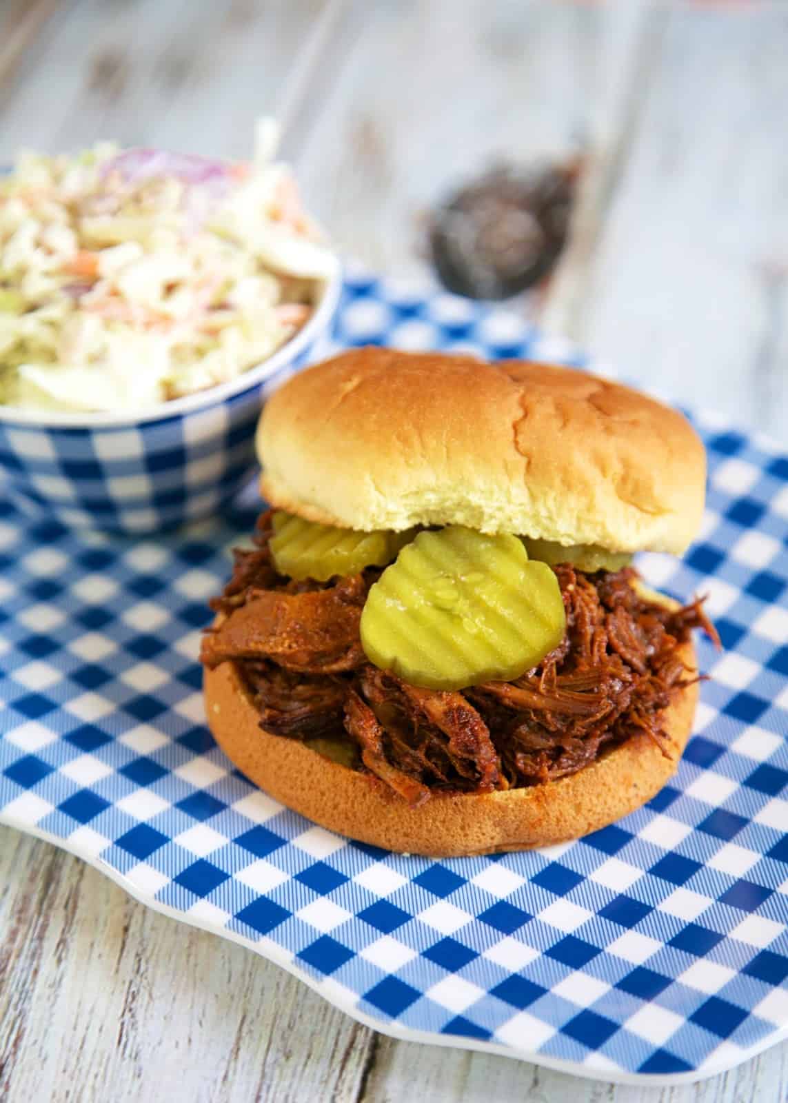 Slow Cooker Beef and Pork BBQ Sandwiches - stew meat and pork tenderloin slow cook in a homemade BBQ sauce. I can't believe I've never combined these two meats before! These are the BEST BBQ sandwiches!!
