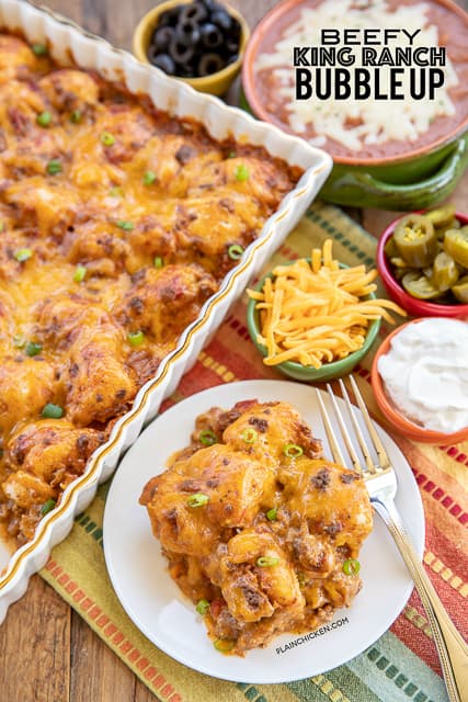 Beefy King Ranch Bubble Up - SO good!!! Ground beef, taco seasoning,  Velveeta cheese, diced tomatoes and green chiles, chicken soup tossed with chopped refrigerated biscuits and baked - use mild rotel if worried about the heat. OMG! SO easy and SO delicious! I wanted to lick my plate! #casserole #mexican #beef #taco #groundbeefrecipe