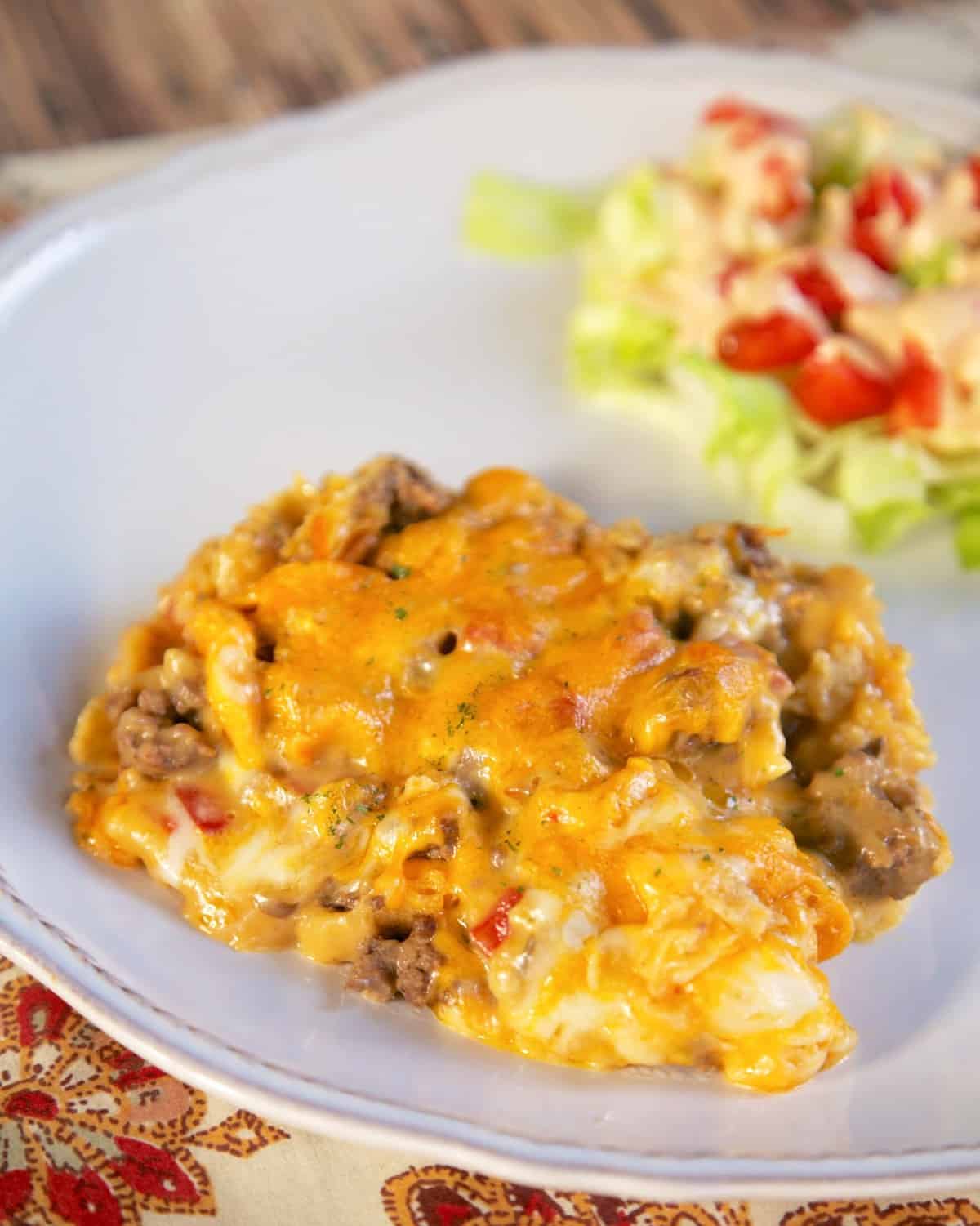 Beefy King Ranch Casserole - tortilla chips, Rotel, meat & cheese = DELICIOUS! The whole family cleaned their plates! Hamburger, taco seasoning, cream of chicken, cream of mushroom, onion, Rotel, Cheez Whiz, hot sauce, worcestershire, tortilla chips, cheddar and mozzarella cheese. Can make ahead of time and refrigerate or freeze. Ready in about 30 minutes. SO delicious!