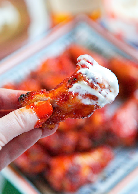 Bourbon Glazed Wings recipe - chicken wings marinated in a quick homemade bourbon hot sauce then baked. These wings were SO good! I am going to make them again for dinner this week. There weren't any left!