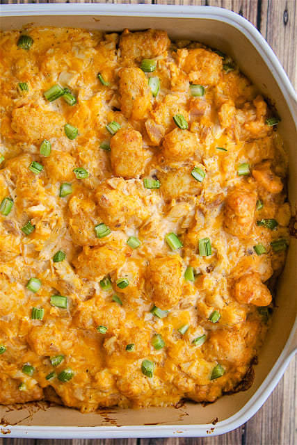 Buffalo Chicken Tater Tot Casserole - SO good! Great casserole for a potluck or watching football!! Everyone LOVES this recipe! Chicken, sour cream, cream of chicken soup, buffalo wing sauce, cheddar cheese, tater tots and celery. Can make ahead and freeze for later. 