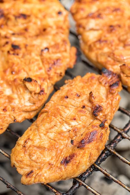 Buffalo Ranch Grilled Chicken - all the flavor of wings but without the messy fingers! This chicken is CRAZY good!! Only 5 ingredients in the marinade - olive oil, Ranch, buffalo sauce, Worcestershire and garlic. Can marinate overnight for maximum flavor. We always double the recipe and there are never any leftovers! Such a delicious quick and easy chicken recipe!
