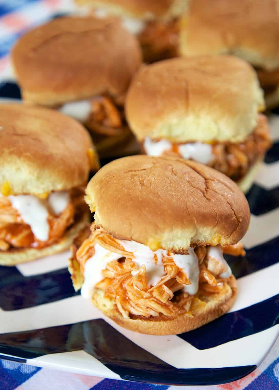 Slow Cooker Buffalo Chicken Sliders -  only 3 ingredients! Chicken, Buffalo sauce and Ranch! These things are SO good! GREAT for tailgating. Can serve on buns, nachos, tacos or on top of a salad. Can freeze leftovers!