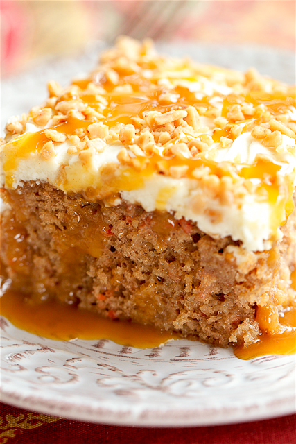 Caramel Carrot Poke Cake - carrot cake soaked in sweetened condensed milk and caramel and topped with a quick homemade cream cheese frosting. SO good! Great for potlucks and the holidays. 